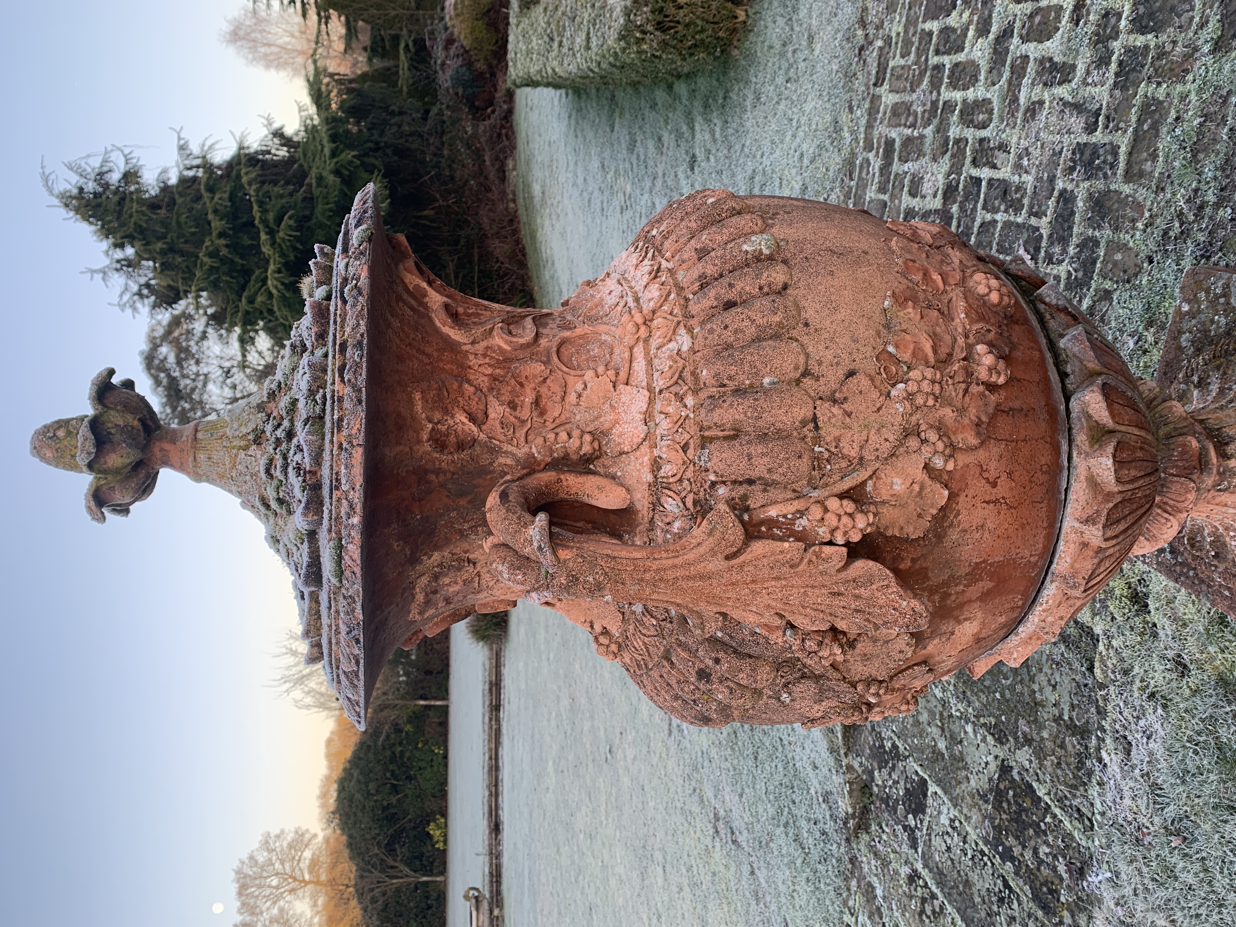 Pair of terracotta two handled lidded urns on plinths - Image 5 of 5