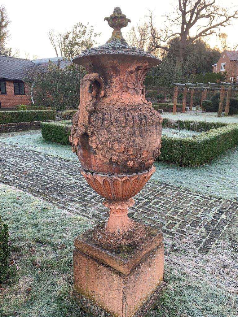 Pair of terracotta two handled lidded urns on plinths - Image 4 of 5