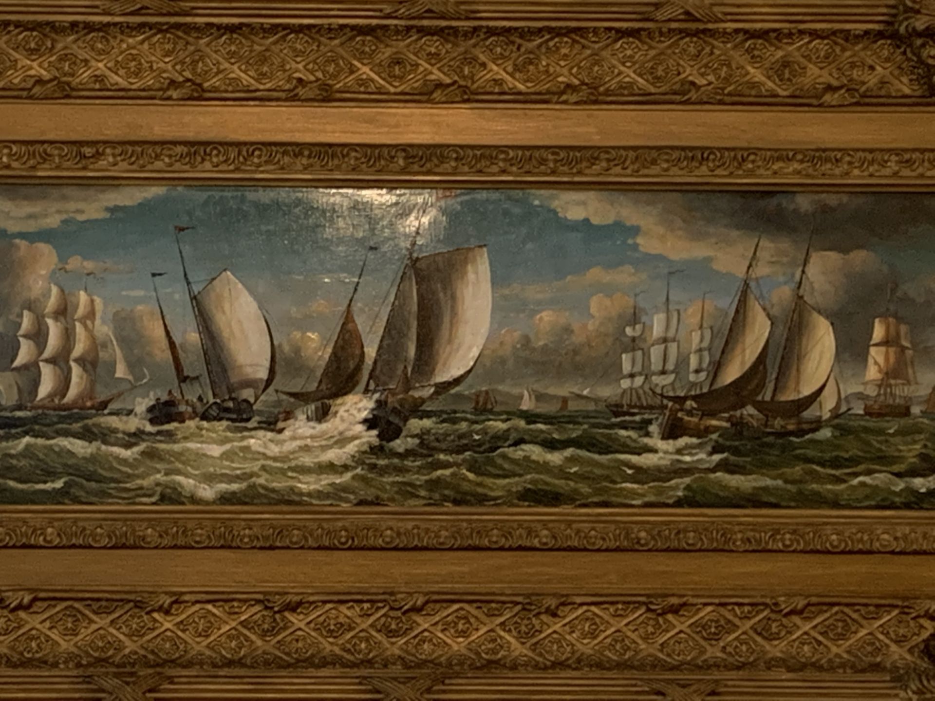 Heavy gilt framed oil on board of sailing ships