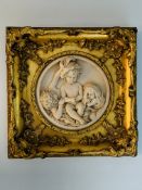 Two gilt framed cast marble high relief moulds with scenes of girls