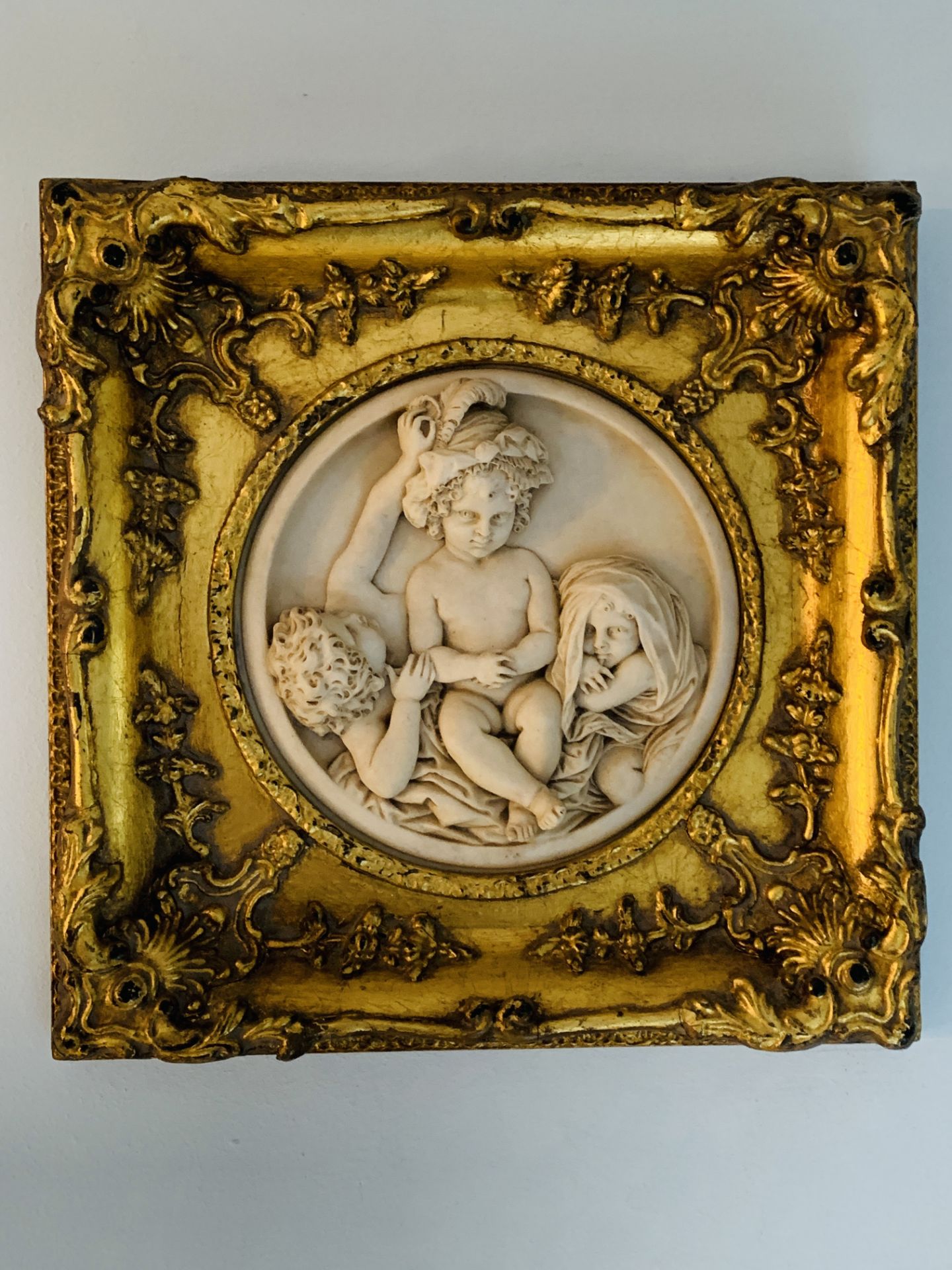 Two gilt framed cast marble high relief moulds with scenes of girls