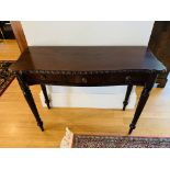 Serpentine edge carved hardwood side table