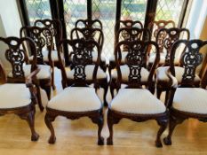 A set of twelve hardwood dining chairs