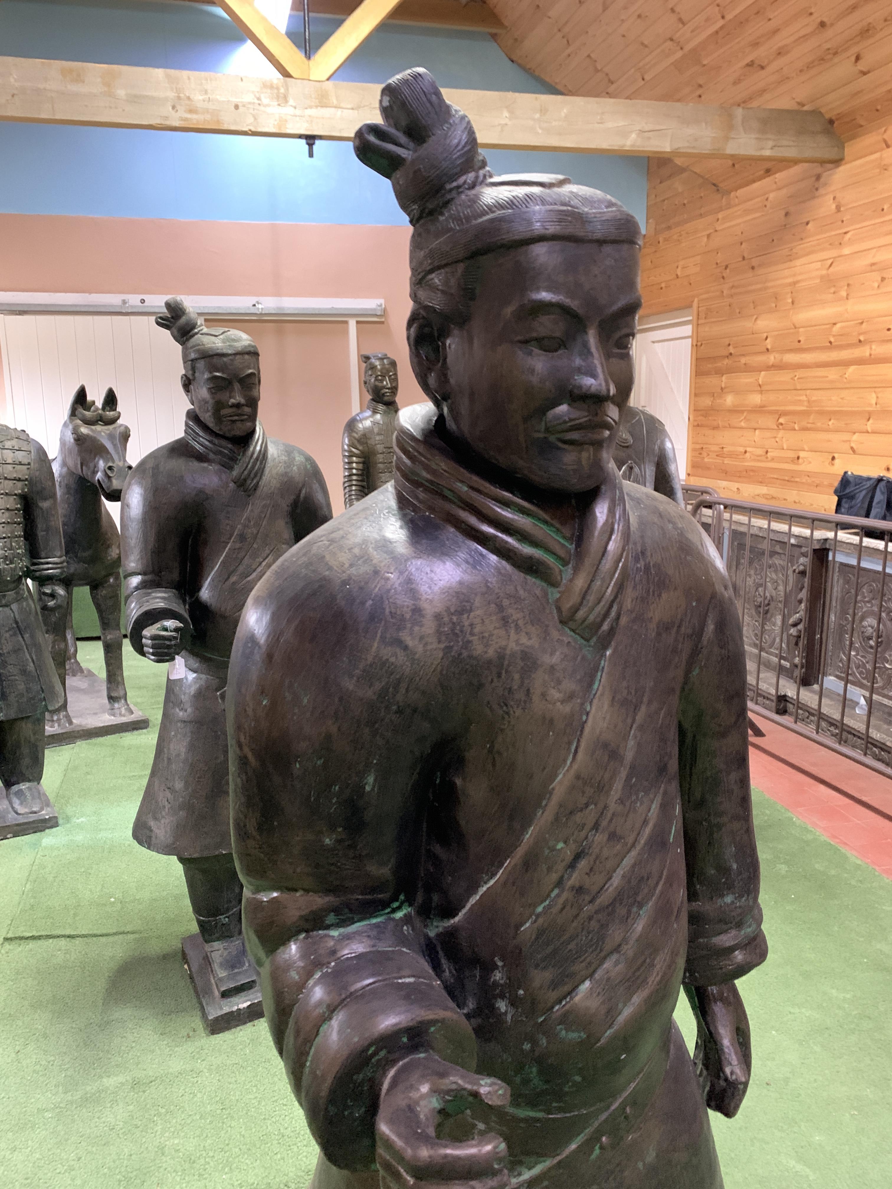 A Qin style terracotta figure of a standing soldier