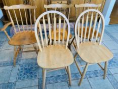 Two pairs of kitchen chairs together with an elbow chair