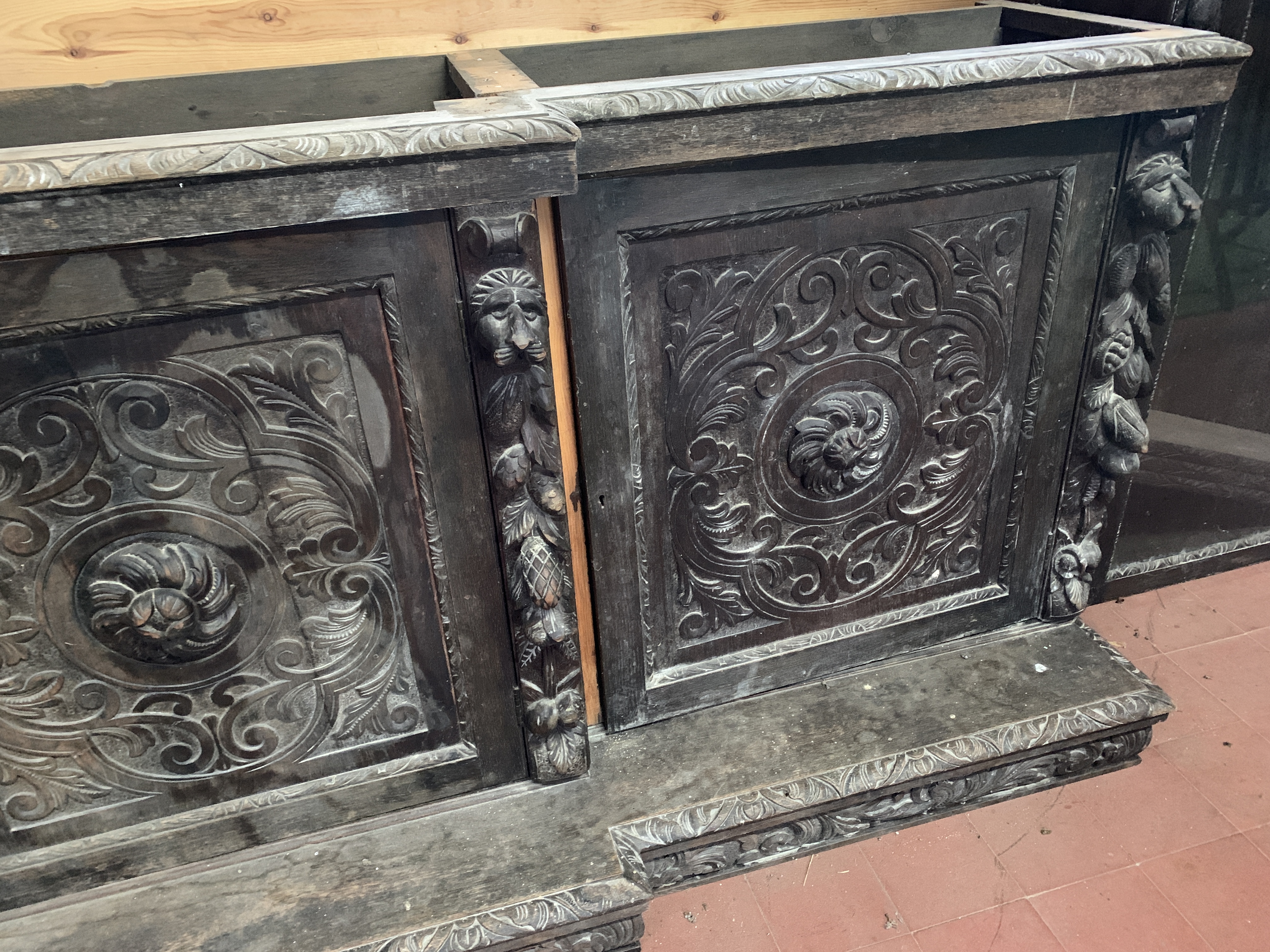 Victorian heavily carved glazed bookcase over four cupboards - Image 8 of 10