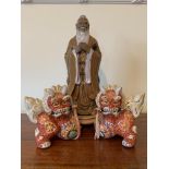 Pair of ceramic Chinese dragon figurines together with a Chinese ceramic figurine of a man