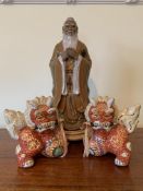 Pair of ceramic Chinese dragon figurines together with a Chinese ceramic figurine of a man