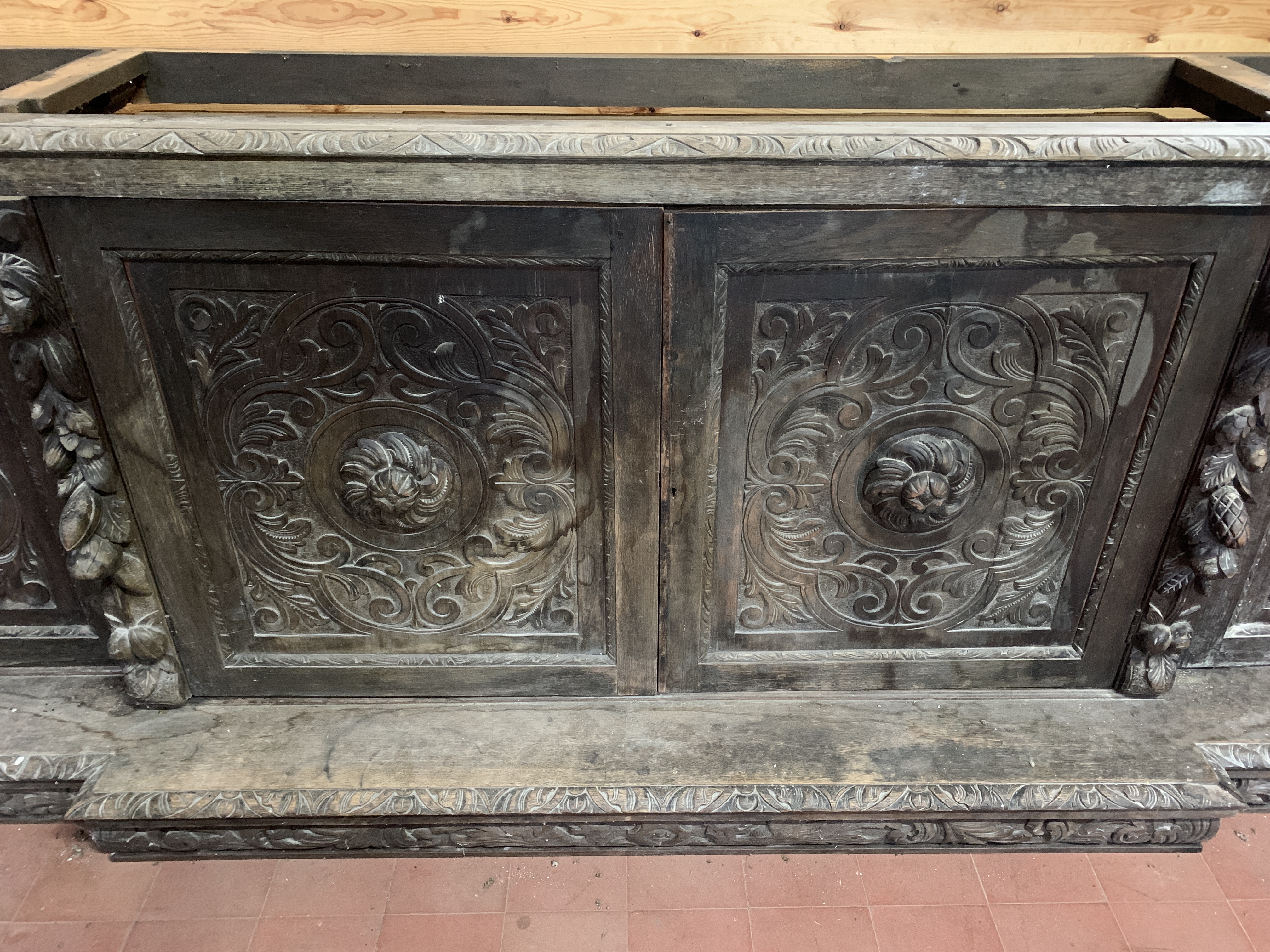 Victorian heavily carved glazed bookcase over four cupboards - Image 9 of 10