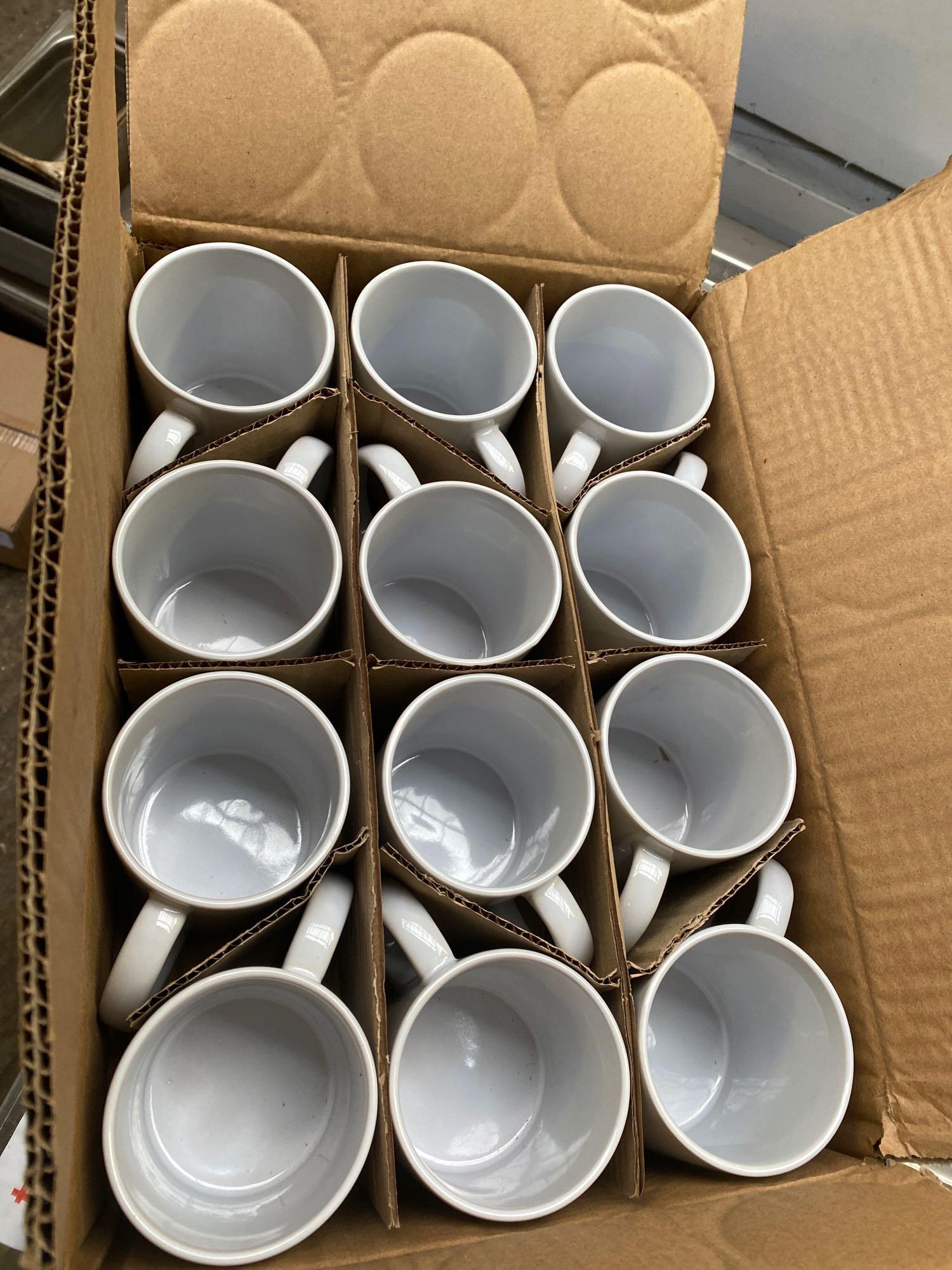 Twelve straight sided mugs