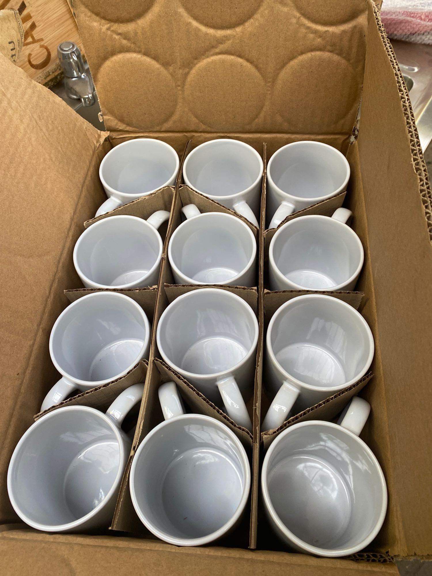 Twelve straight sided mugs