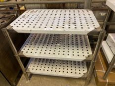 Three tier table with perforations
