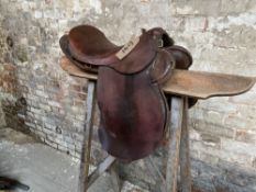 18" military saddle by Barnsby together with a 17" military saddle