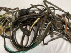 Quantity of assorted tack, including a large qty of stirrup irons