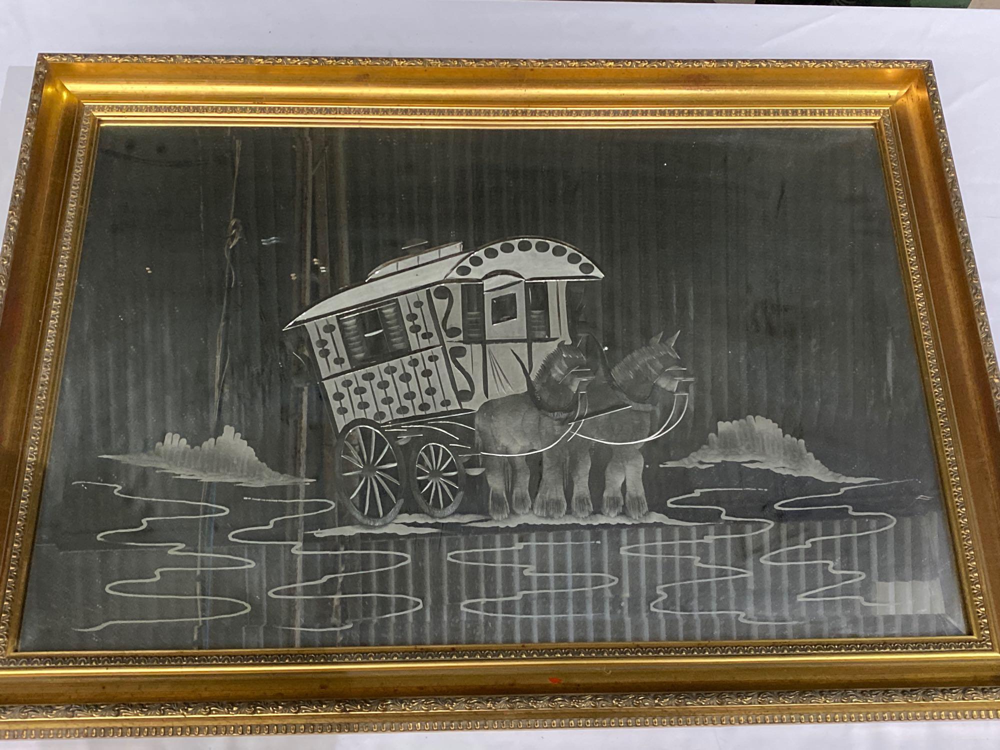 Gilt framed bevelled edge wall mirror with etched scene of a gypsy caravan being pulled by a pair