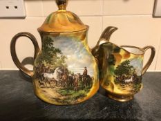 Tea pot and milk jug. Tea pot and milk jug decorated with scenes of horses.