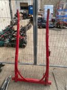 Pair of small red painted wooden shafts