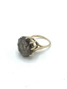 9ct gold ring set with large brown stone