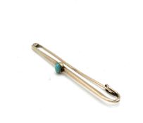 9ct gold bar brooch set with a single oval turquoise cabochon