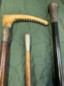 A silver topped walking stick, hunting crop and military swagger stick