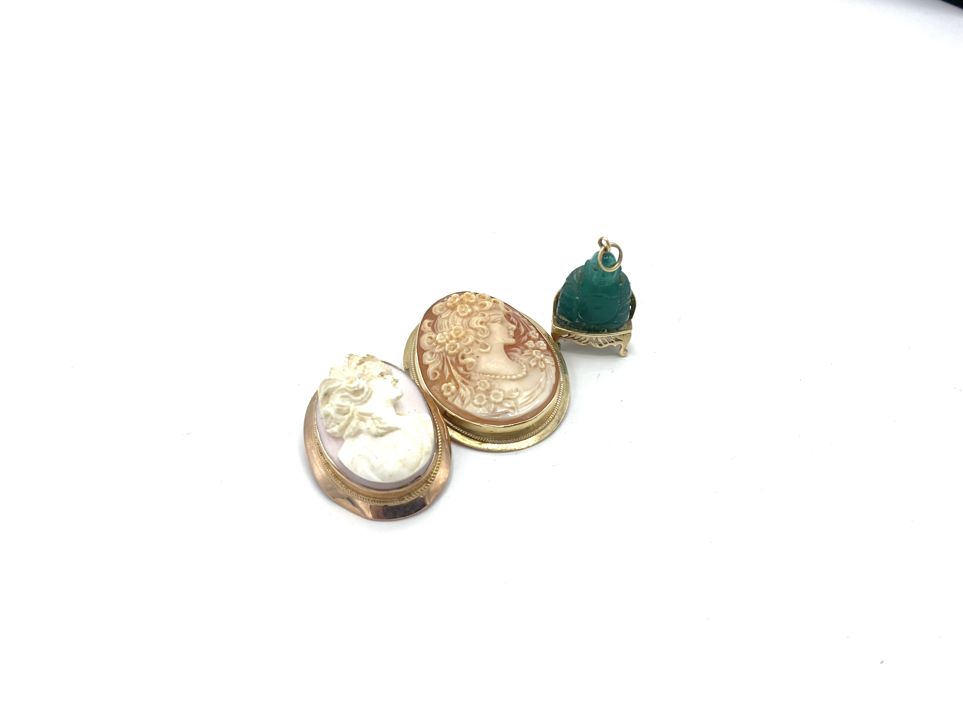 Two 9ct gold brooches and a 9ct gold and jade pendant