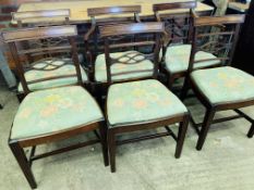 Four mahogany ladderback dining chairs