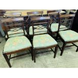 Four mahogany ladderback dining chairs
