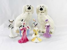 Six Coalport figurines together with a pair of Beswick dogs