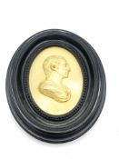 Relief silhouette of Robert Adam, in oval black wood frame