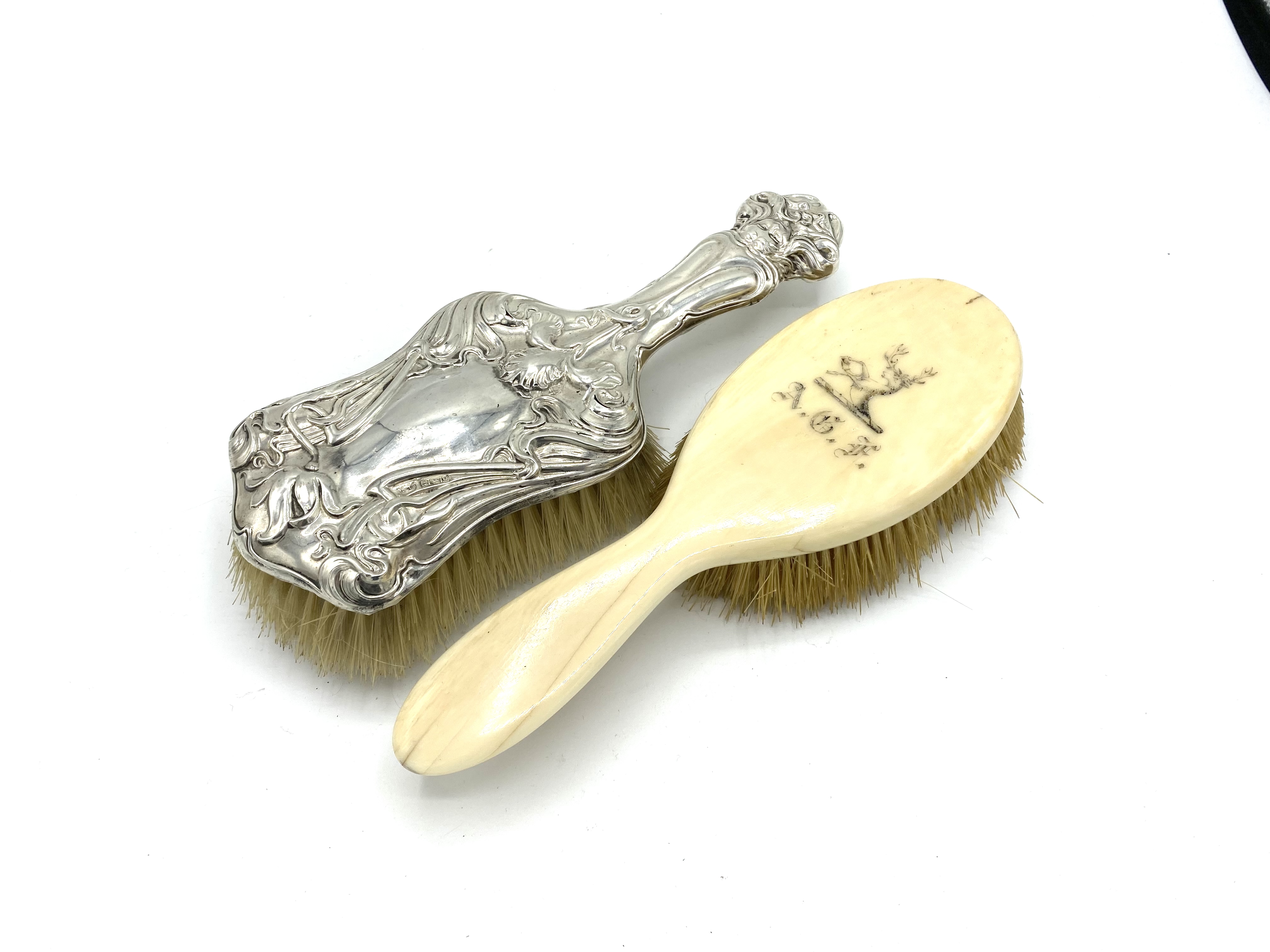 Art nouveau silver hairbrush, together with another