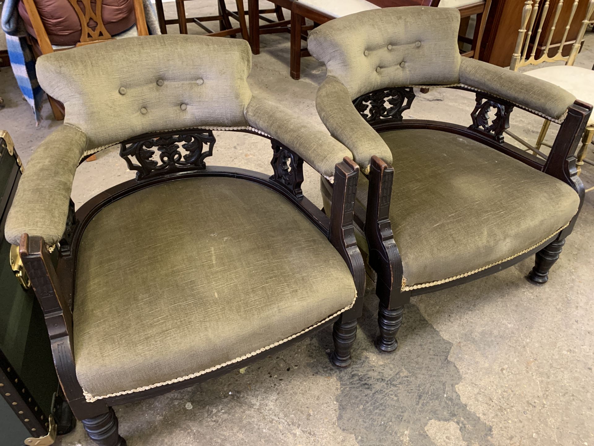 Pair of open back upholstered tub chairs