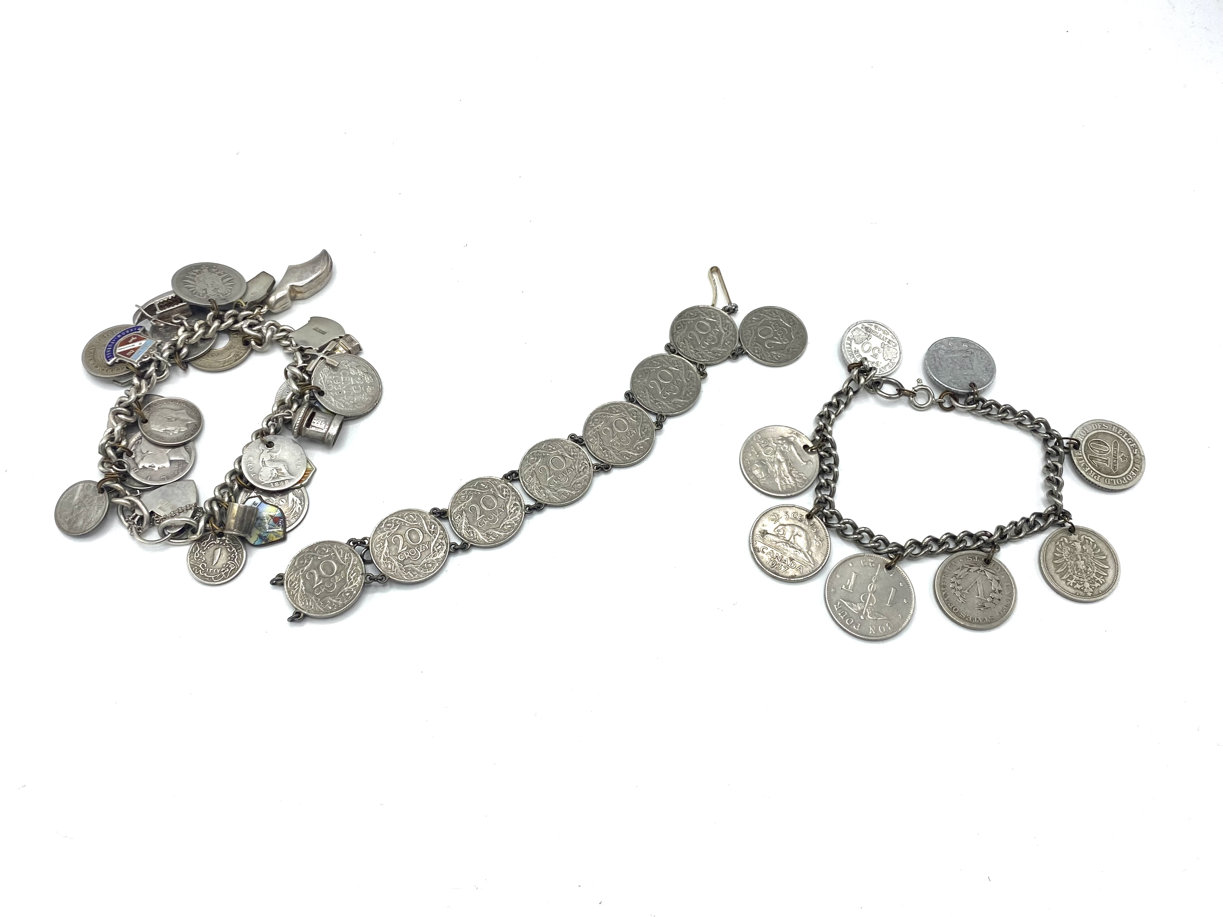 Hallmarked silver charm bracelet and two coin bracelets