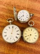 Three silver cased pocket watches.