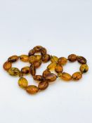 Insect amber lozenge shaped bead necklace