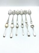 Six Georgian silver table spoons and six silver tea and cruet spoons