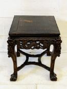 Carved wood side table