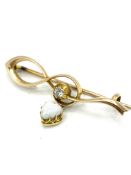 Gold brooch with centre diamond & heart shaped opal drop