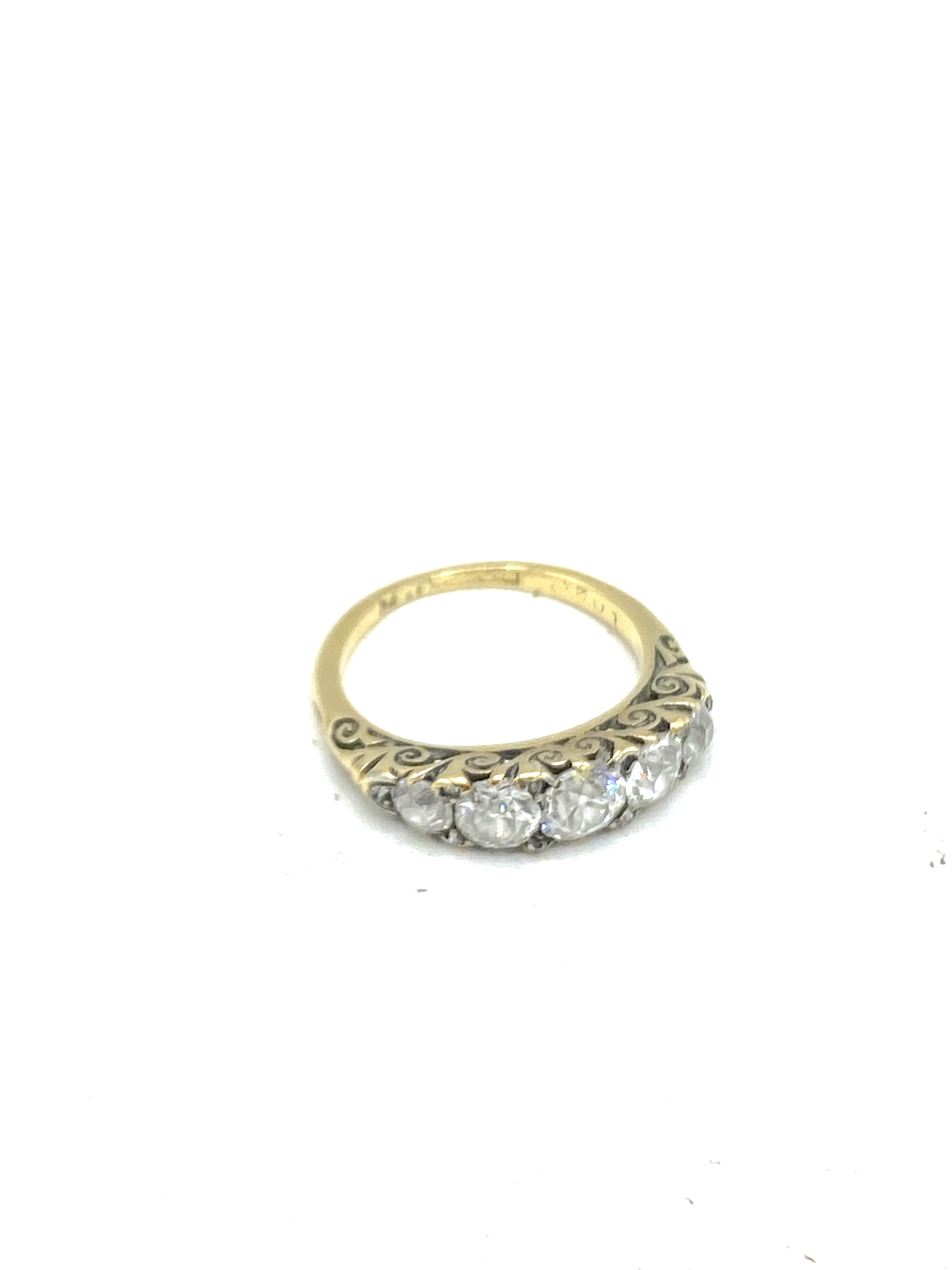 Five stone diamond ring set on an 18ct gold band
