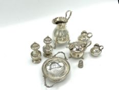 Silver tea strainer and other items