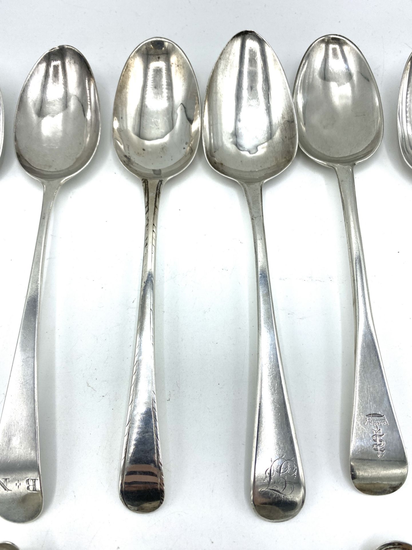Six Georgian silver table spoons and six silver tea and cruet spoons - Image 3 of 6