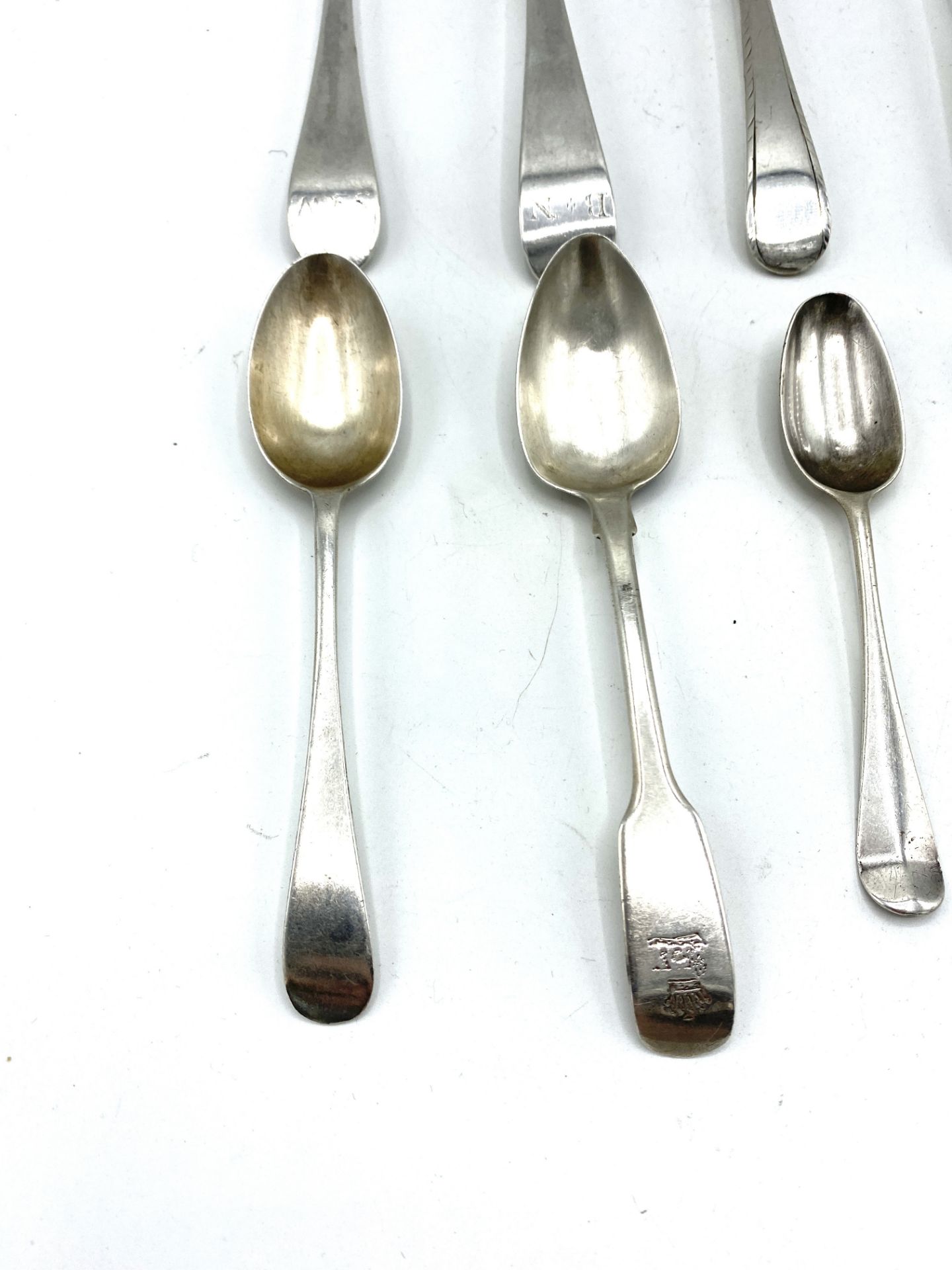 Six Georgian silver table spoons and six silver tea and cruet spoons - Image 4 of 6