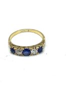 Sapphire and diamond five stone ring set on a gold band