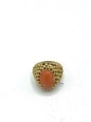 18ct gold ring, set with a coral stone