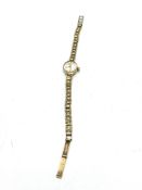 Ladies Accurist watch, with 9ct gold strap and case