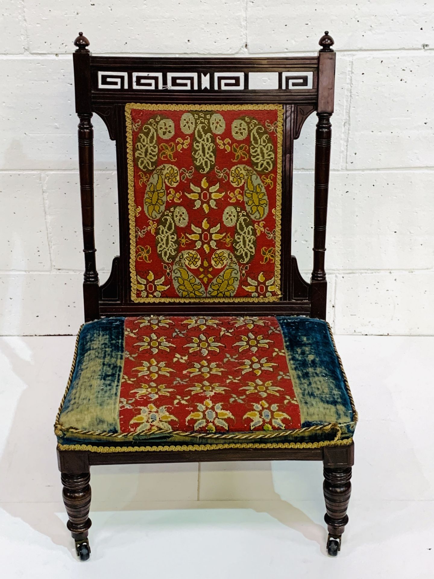 French Mahogany 19th Century nursing chair with original fabric.