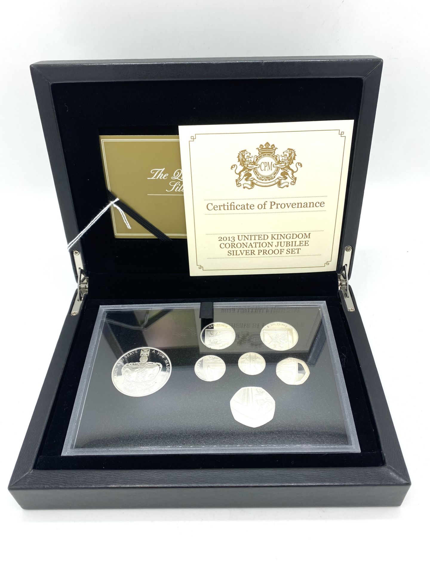 2013 Queen's Coronation silver seven piece set.