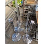 Six stainless steel barrier stands