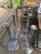 Six stainless steel barrier stands