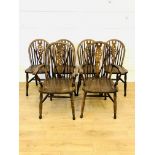 Four dark wood kitchen chairs together with two matching carvers