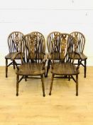 Four dark wood kitchen chairs together with two matching carvers